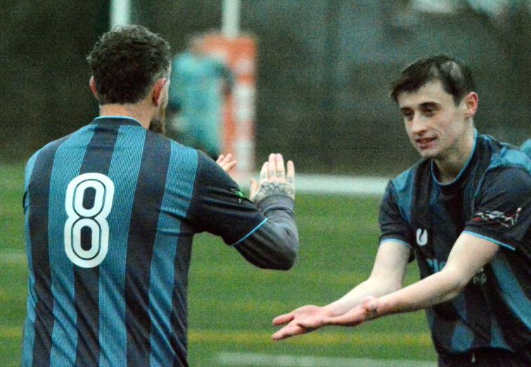 Tyler Sheil congratulates Tish goal scorer Adam Kingsbeer (No 8)